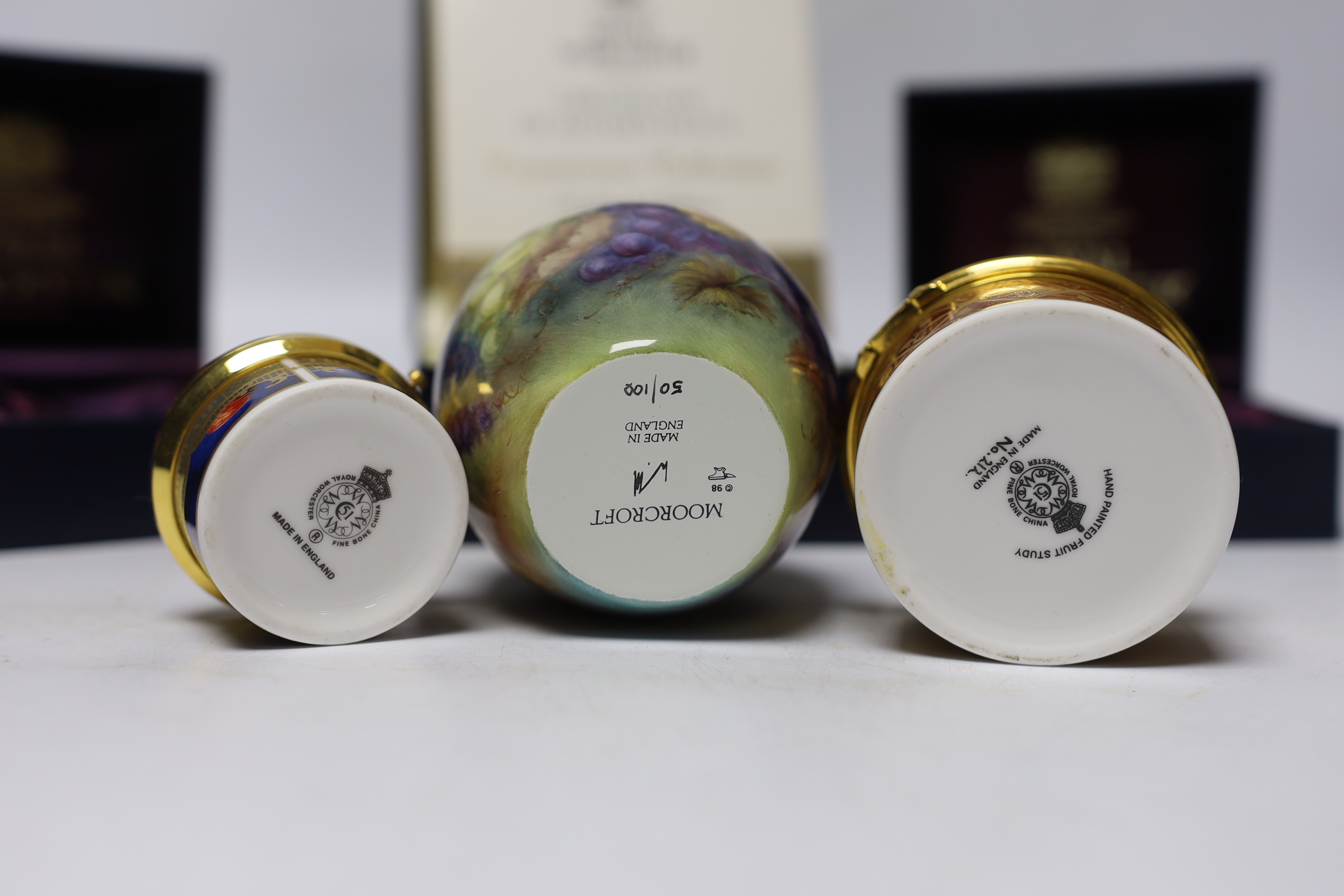 A modern boxed limited edition Moorcroft enamel vase, together with two Royal Worcester boxed porcelain boxes (3)